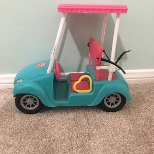 A Barbie golf cart